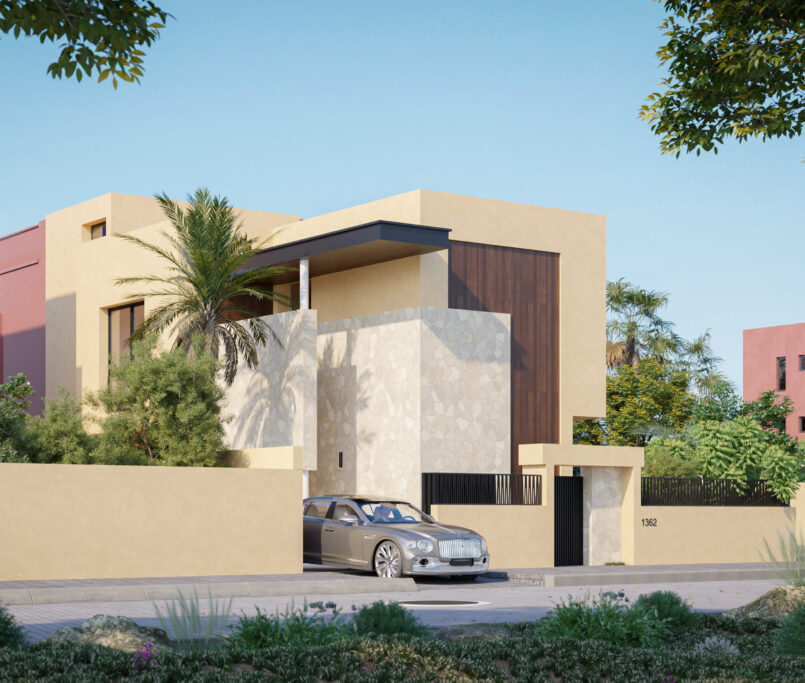 Une maison beige moderne avec des accents de pierre et de grandes fenêtres est entourée d'une végétation luxuriante et d'un mur jaune. Une voiture de luxe argentée est garée dans l'allée. D'autres maisons colorées sont visibles à l'arrière-plan sous un ciel clair.